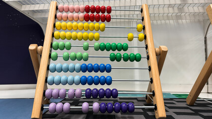 Colorful abacus beads echo ancient numeracy wisdom, International Numeracy Day, playful learning, vintage counting magic, discovery joy