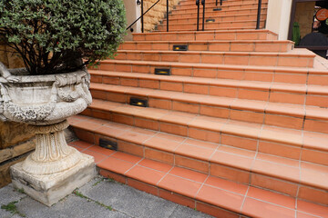 Stairs in the city,Granite stairs and red brick wall,Stone stairway Modern,concrete stairs outside,Empty modern building composition.