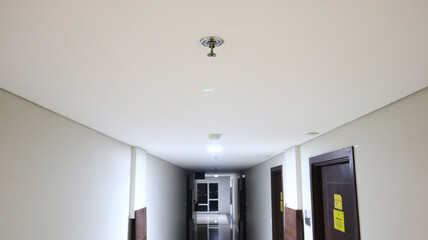 Sprinkler fire extinguishers in the apartment hallway for the safety of the residents