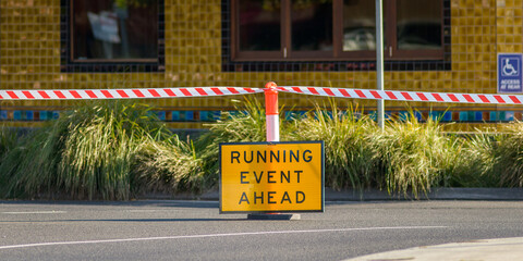 Sign saying running event ahead