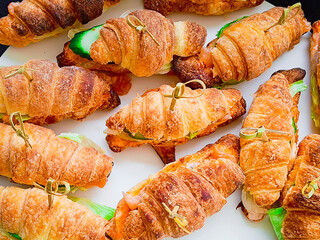 Croissants with meat and vegetable filling. Beautifully served dishes in a restaurant. Close-up. healthy and tasty food.