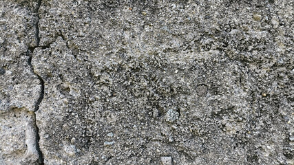 Macro concrete wall with mild textures, subtle cracks, and weathered effects. High-resolution detail for use in grunge backgrounds, construction reference, or vintage layout projects.