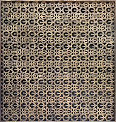 Close up of oxidized and weathered laser cut panel in round circle pattern. Suitable for screens and partition divider. Antique industrial looking. Seamless background texture.
