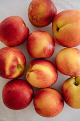 Beautiful ripe nectarine with aromatic skin, top view of fresh summer fruit