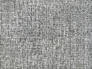 Close up of grey linen fabric, or grey wallpaper. for graphic background. seamless background texture.