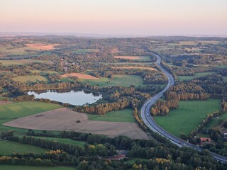 Highway D1 winding through hilly Vysocina landscape near Humpolec and Jihlava