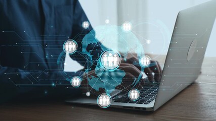 Individual using a laptop at a wooden desk, surrounded by digital icons representing global connectivity and networking for modern business solutions. Qubit - Powered by Adobe