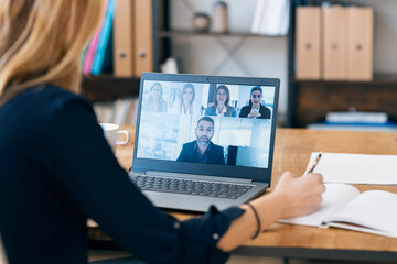 Professional team in online video conference call at workspace