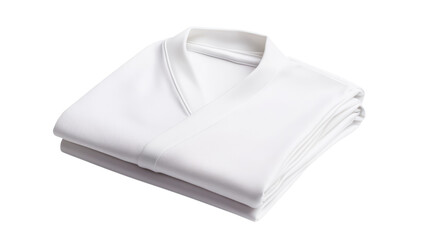 A neatly folded white garment rests on a plain background, emphasizing its simplicity and elegance