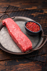 High quality marbled wagyu beef steak, ready to be transformed into a gourmet masterpiece. A delicious choice for any meat lover's palate. wooden background. top view