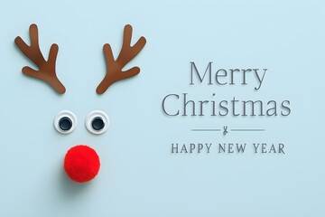 Festive christmas reindeer face crafted from googly eyes and a red pom pom nose with merry christmas and happy new year text on a light blue background