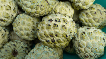 Close Up Pile Of Green Cherimoya Fruit