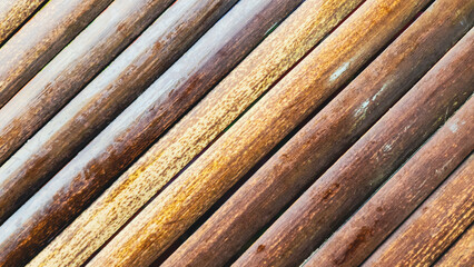 The art of bamboo design. Rows of bamboo stalks arranged diagonally, in a variety of natural colors, create a traditional, warm, simple, and nostalgic feel.