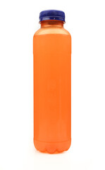 Plastic bottle with blue cap full of orange juice isolated on white background. Long mockup bottle
