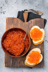 Salty salmon roe, red caviar, ideal for adding a touch of elegance to your culinary creations. grey ackground. top view