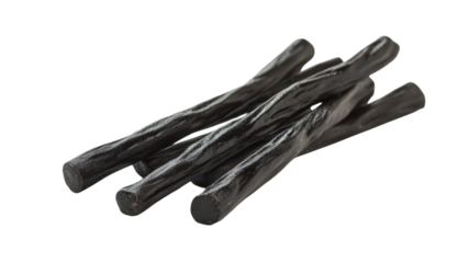 Glossy black licorice sticks are twisted together, creating a striking visual display