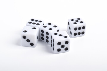 Five white dice on white background, symbolizing luck, chance, probability, and gaming concepts for board games