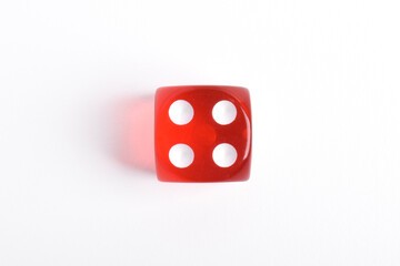One red dice isolated on white background, top view