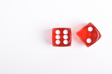 Two red dice isolated on white background, top view