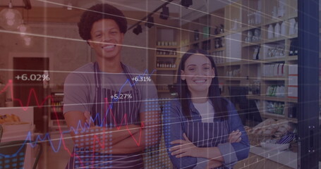 Bakery employees wearing striped aprons smiling behind counter, with pastries and digital charts