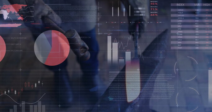 Man in suit analyzing financial data in corporate office, with transparent digital interface