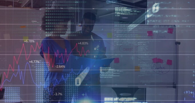 Analyzing diagrams and sticky notes, coworkers wearing business attire in meeting room, with tablet