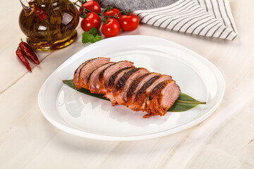 Sliced duck breast baked with cherry