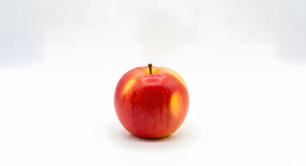 Minimalist Red and Yellow Apple Centered with Ample White Space � Wide Studio Shot