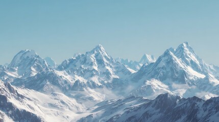 Snow-capped mountain range under a clear sky.