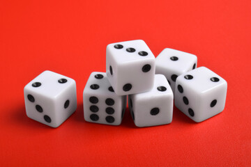 Many dices isolated on red background