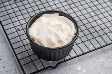 Healthy Fresh greek yogurt in a bowl. grey background. top view