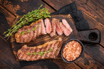Grilled Tri Tip Steak from Black Angus beef meat. wooden background. top view