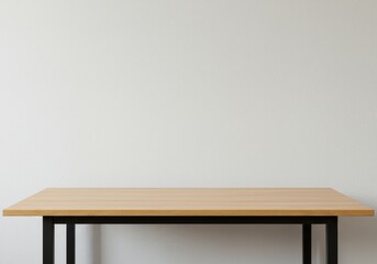 A minimalist wooden desk against a white wall.

