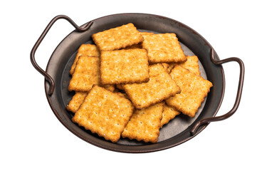 Square salty crackers in wooden tray isolated on white background, top view
