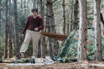 People engaging in recreational camping surrounded by nature, rustic details, and camaraderie.
