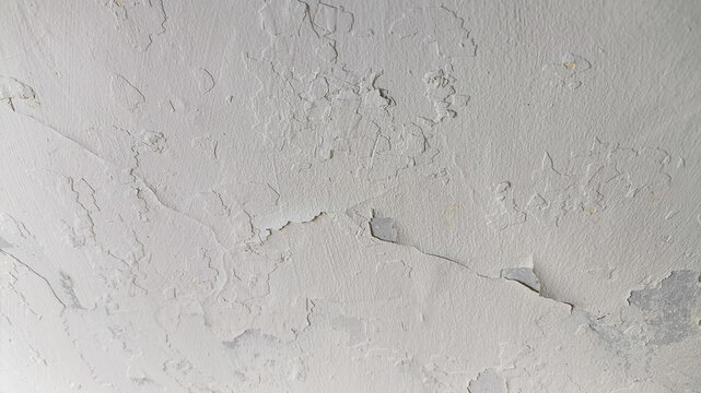 Fractured cement wall texture with horizontal orientation showing damaged concrete, worn finish, and structural breakdown elements.