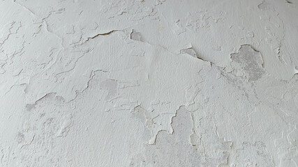 Architectural texture of cracked horizontal concrete wall with rough surface and visible decay for visual reference and digital use.