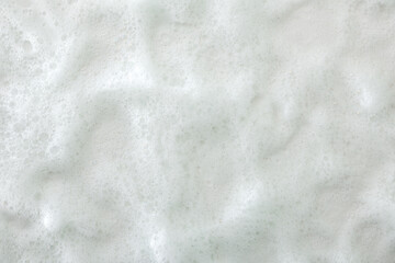 Background with macro of white soap foam