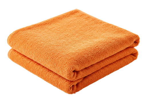 Folded orange towel stack on plain background textile texture