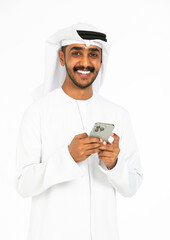Portrait of an emirati man on a white background using mobile.