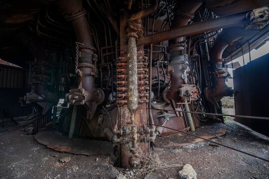 Abandoned Heavy Industrial Ruins with Large Blast Furnace in Steelworks