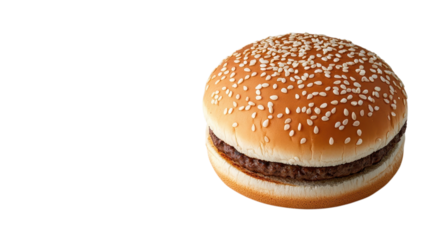 A freshly made sesame seed hamburger bun filled with a flavorful beef patty is displayed on a clean surface
