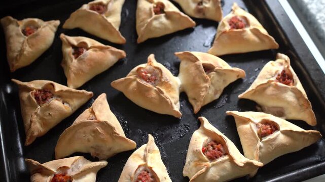 Freshly baked Middle Eastern savory hand pies. Delicious fatayers ready to eat.