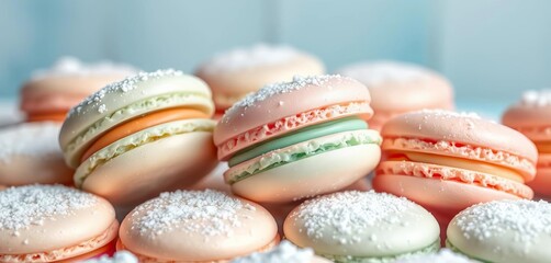 Obraz premium Delicate pastel-colored macarons dusted with a light snowfall of powdered sugar, sprinkles, green