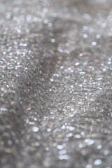 Obraz premium abstract background of silver sequins.