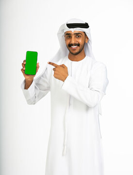Emirati man holding a phone.