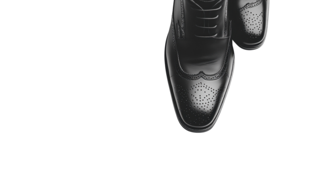 Classy black leather dress shoes stand prominently against a white background, showcasing elegance and craftsmanship