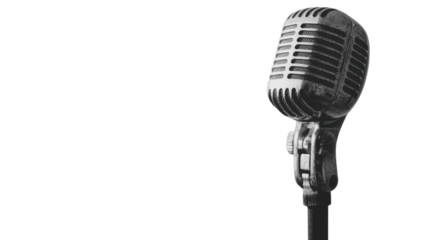 A vintage microphone on a black pole evokes nostalgia and anticipation for a performance