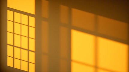 Golden hour sunlight casting shadows of window on wall