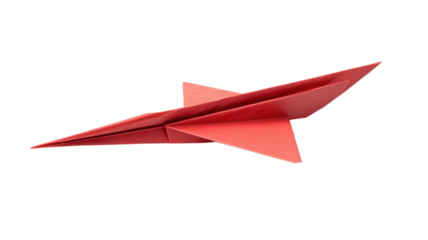 A red origami airplane sits on a white surface, highlighting minimalist paper folding art